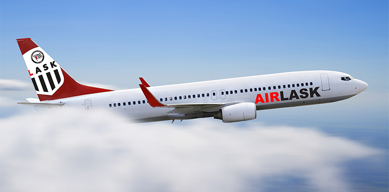 White and red plane flying over the cloud in blue sky