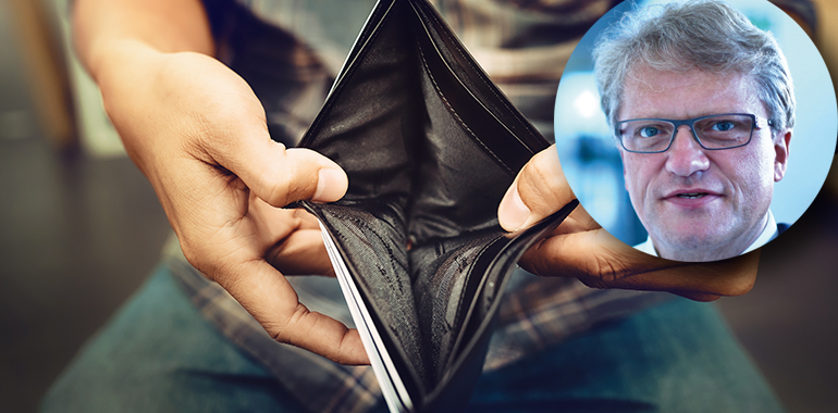 Empty wallet (no money) in the hands of an Businessman
