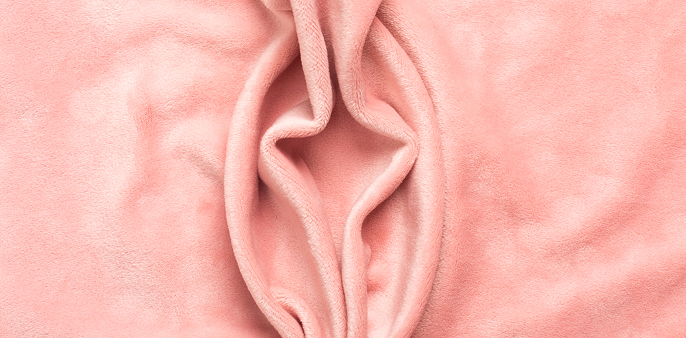 Pink soft fabric shaped as female genital organs, vulva and labia, vagina concept. High quality photo