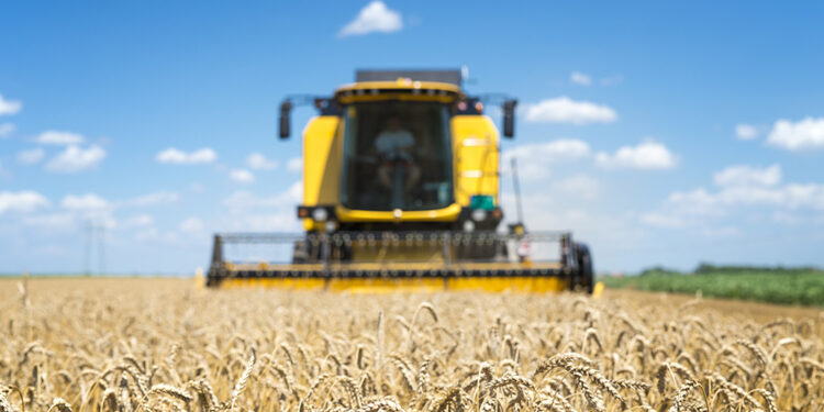 Combine harvester working in the field.